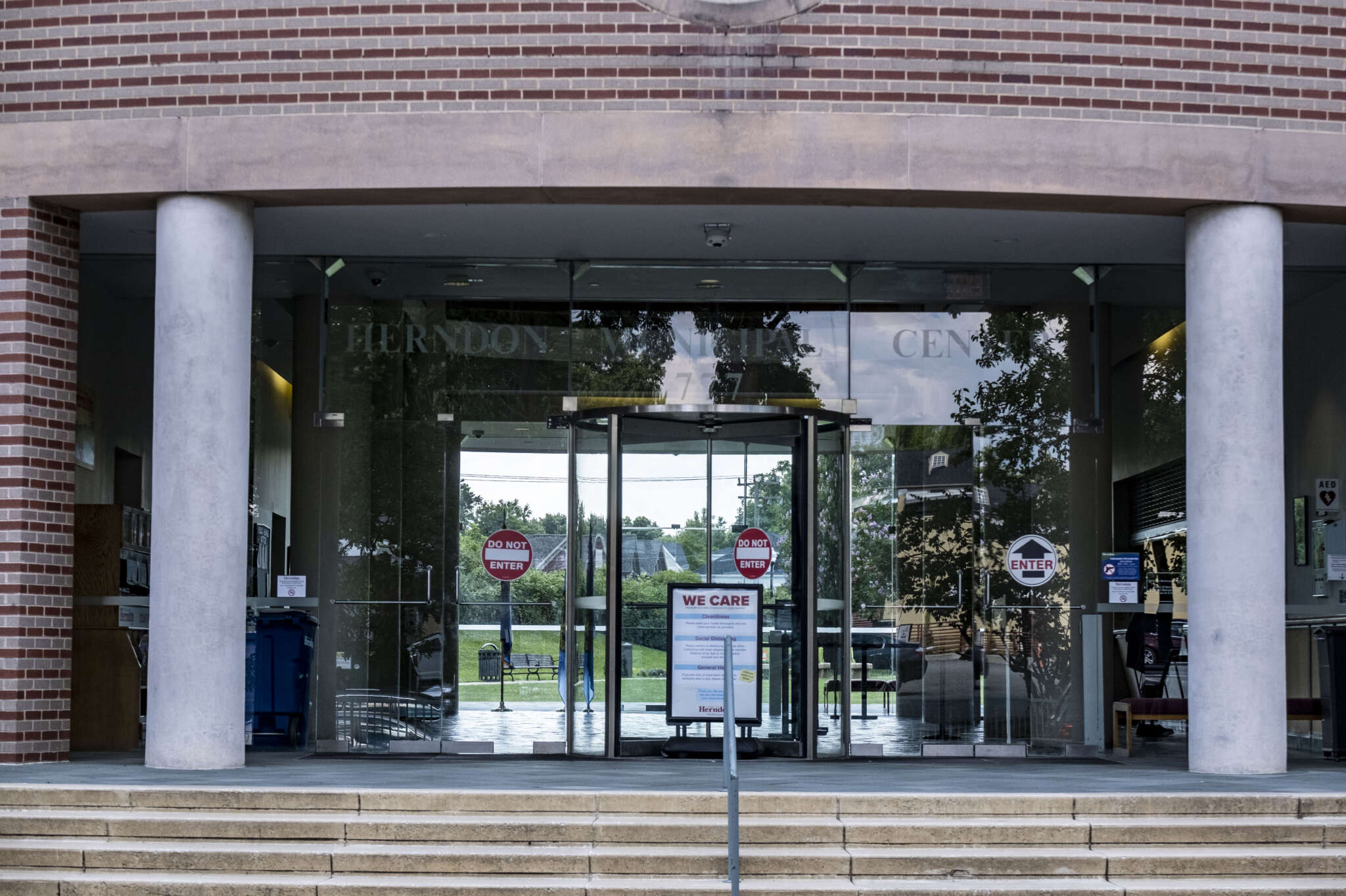 The Herndon Municipal Center front doors (staff photo by Jay Westcott) | FFXnow