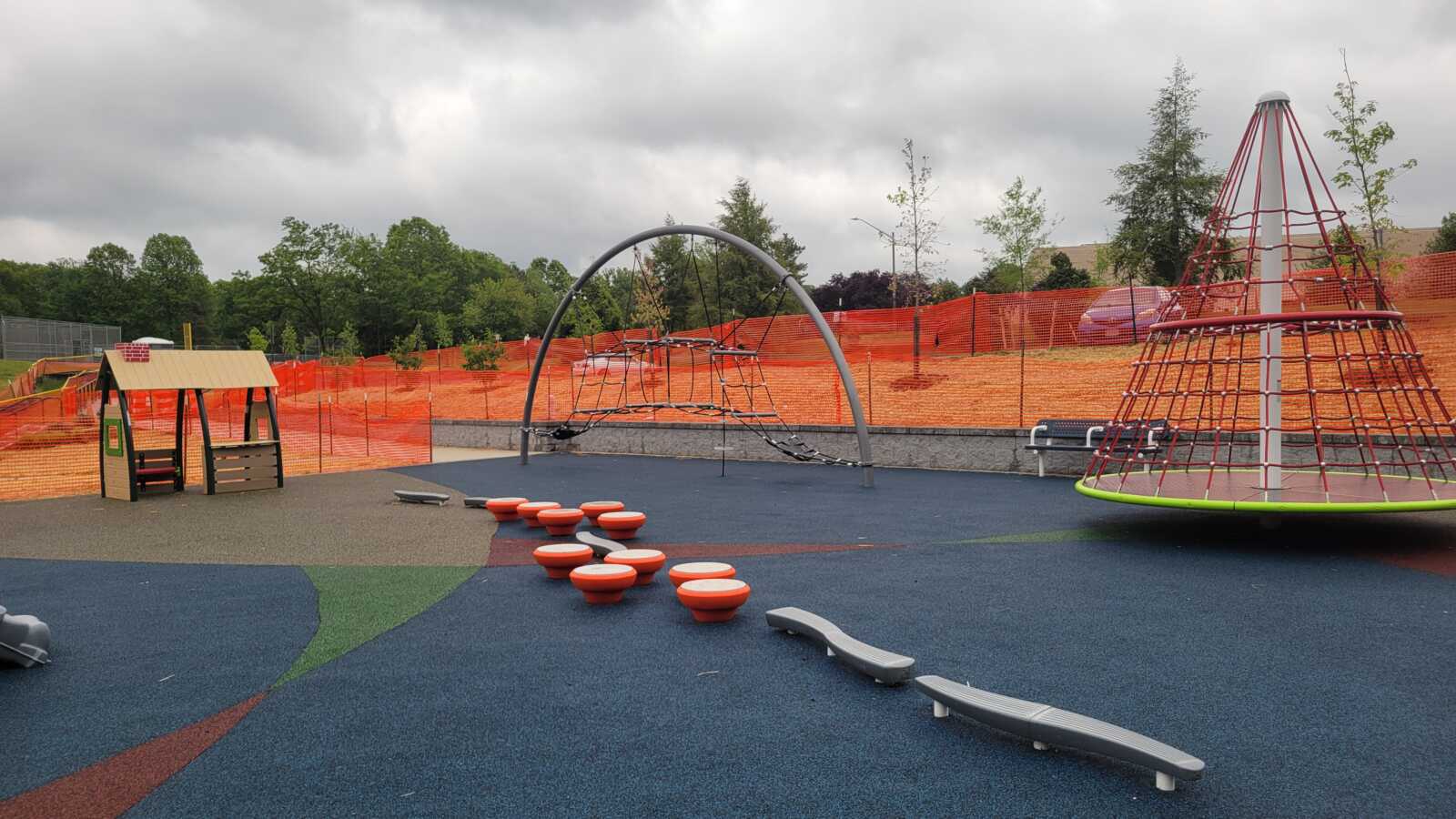 The playground at Reston North is shown in this image. A balance beam and steps are in the middle.