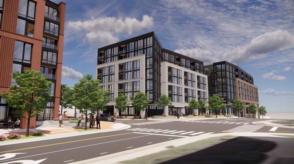 Rendering of a modern mixed-use development along a tree-lined street with brick and glass facades.