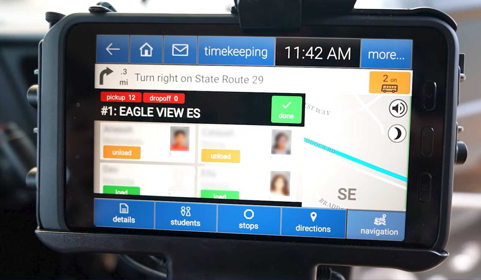 In-car GPS screen showing a right turn onto State Route 29 with a blue bottom menu (details, stops, directions, navigation).