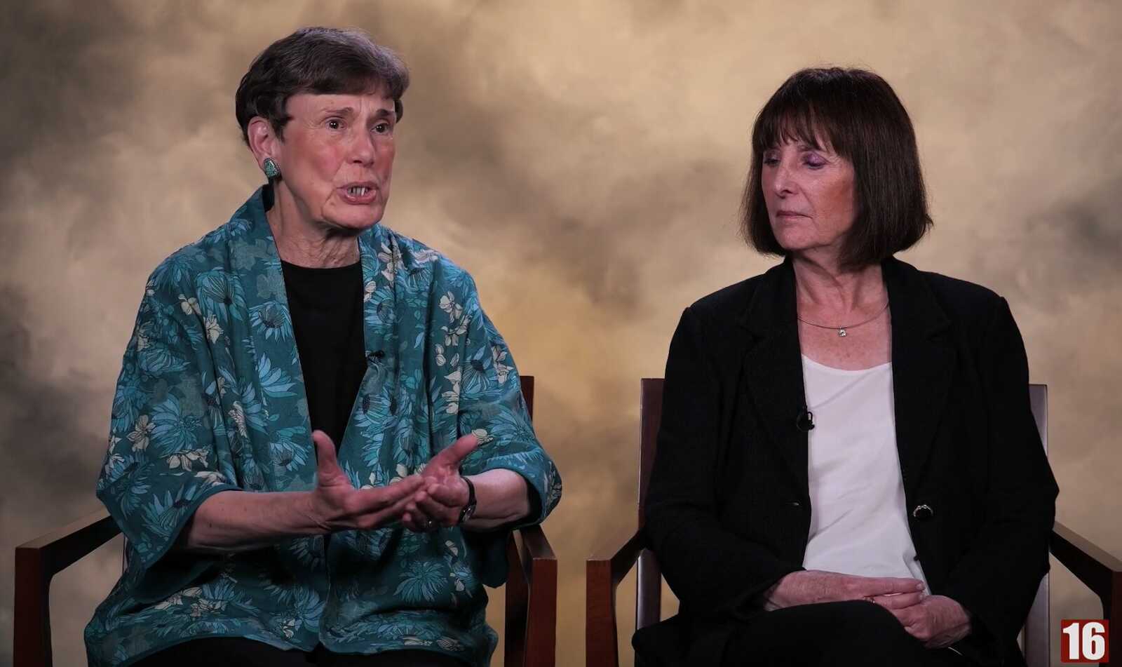 Former Providence District Supervisor Linda Smyth and former Fairfax County Department of Planning and Development director Barbara Byron (via Fairfax County Channel 16) | FFXnow Two women sit in a studio interview setting; the left speaker in a teal floral jacket gestures with hands while the right listener watches.