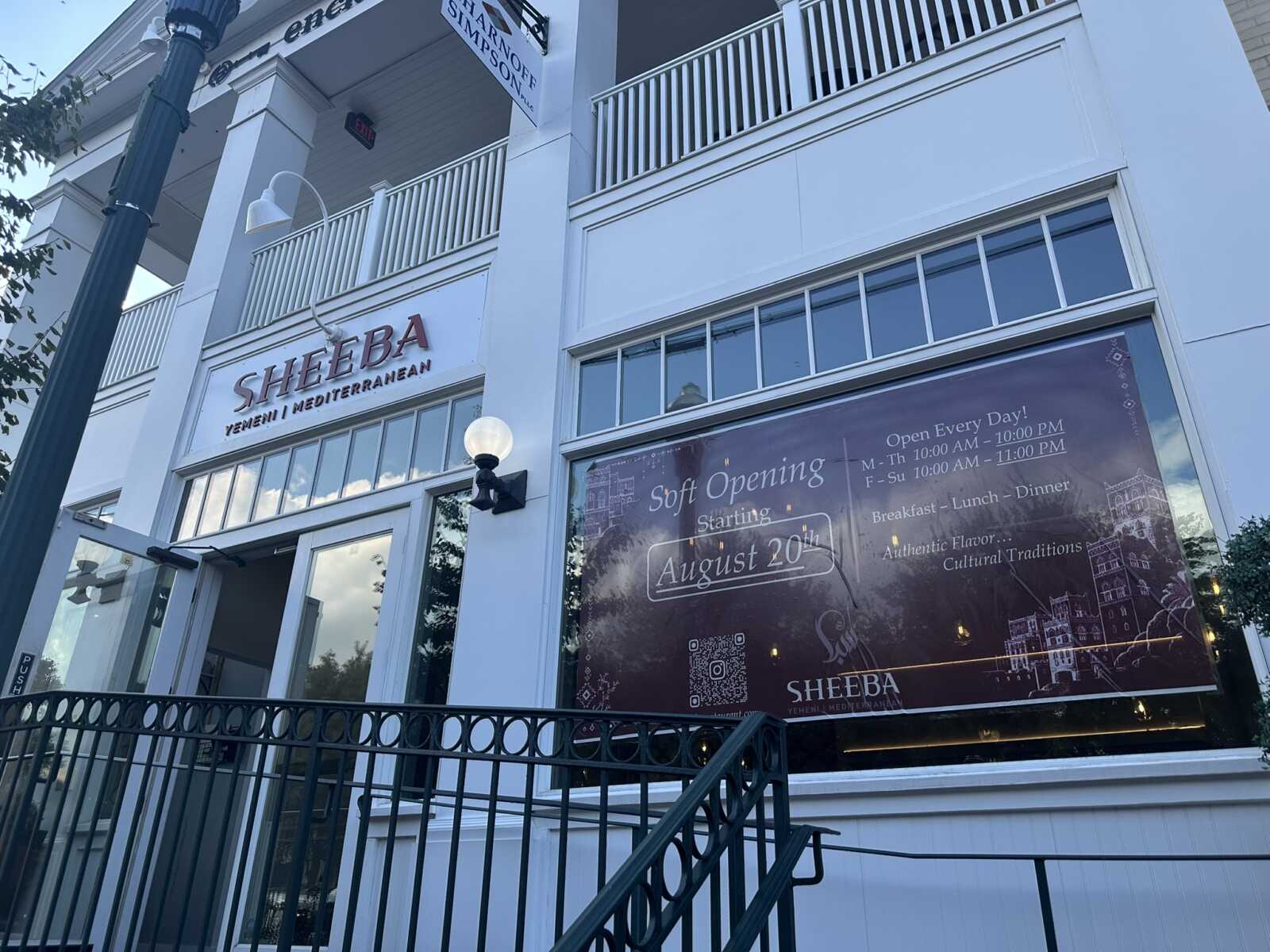 Front of the Sheeba Yemeni/Mediterranean restaurant with a large 'Soft Opening' banner announcing August 20th