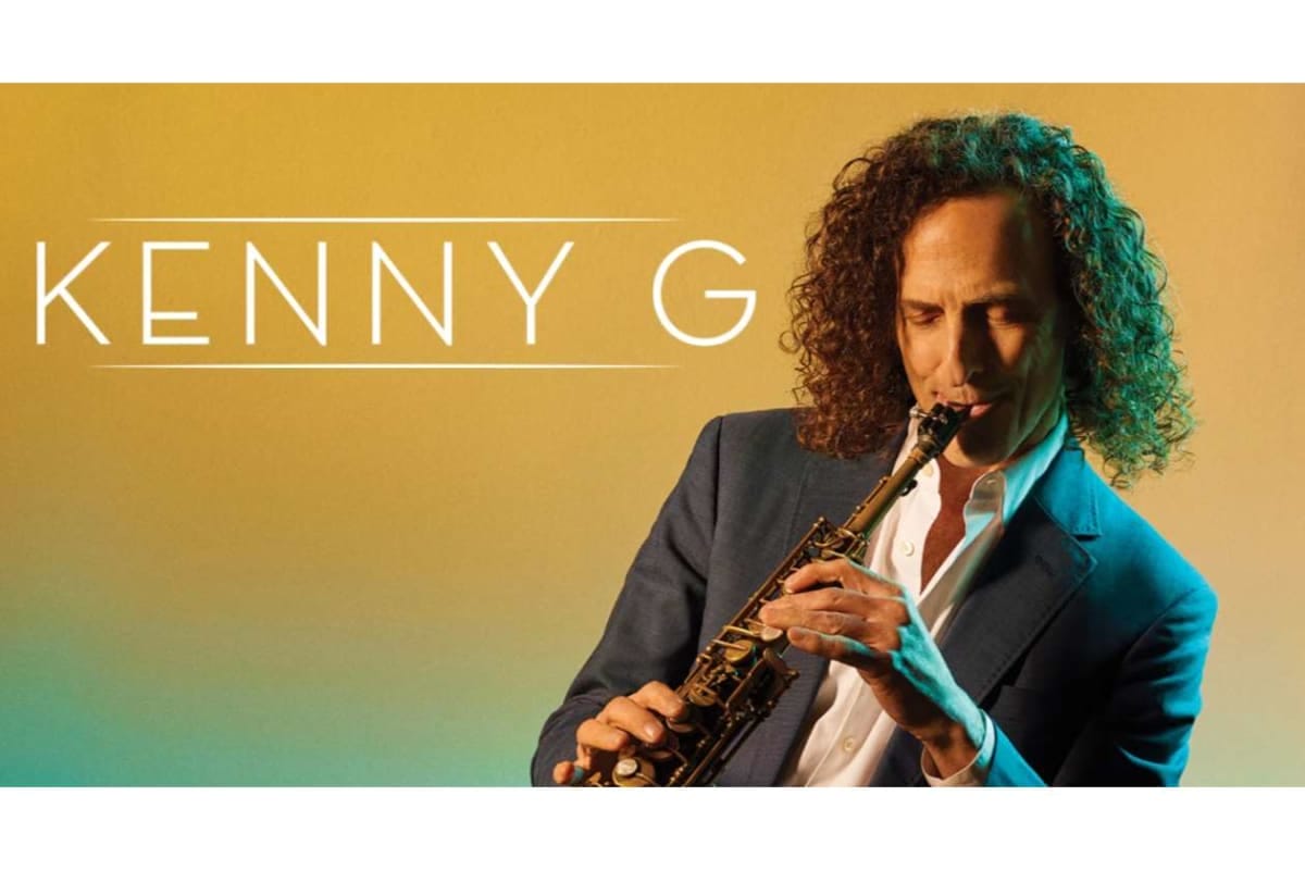 Promotional banner with the text 'KENNY G' on the left and a man in a suit playing a saxophone against a warm gradient background.