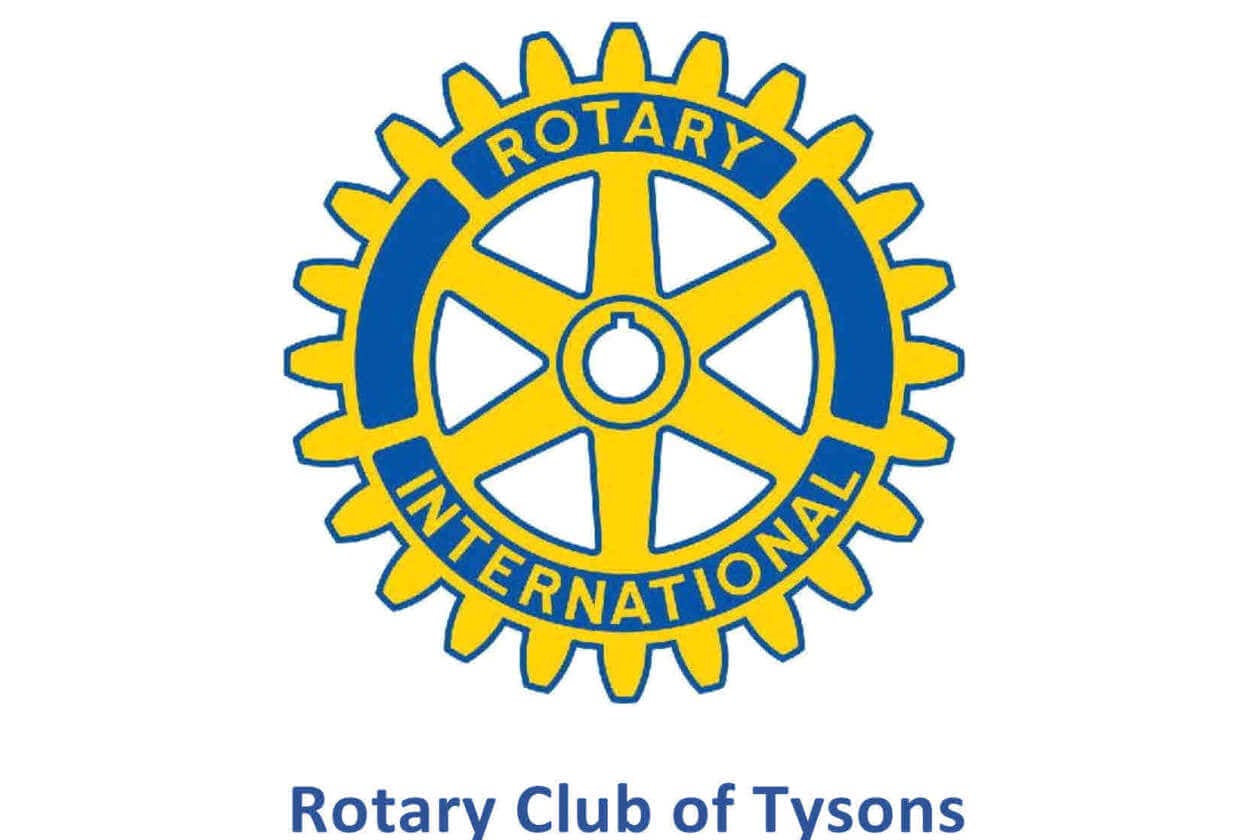 Rotary International gear logo in yellow and blue with 'Rotary' and 'INTERNATIONAL' around the wheel, and 'Rotary Club of Tysons' beneath.