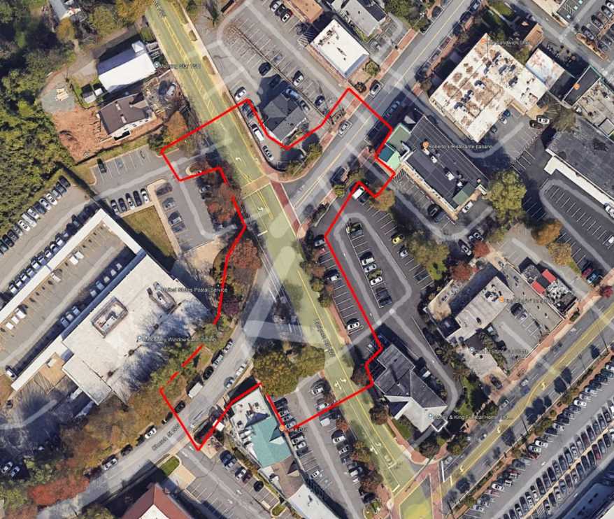 Study area for the Lawyers Road and Church Street NW Intersection Reconfiguration Project (via Town of Vienna) | FFXnow Aerial view of a street map with a red outlined property boundary crossing multiple intersections and parking lots.