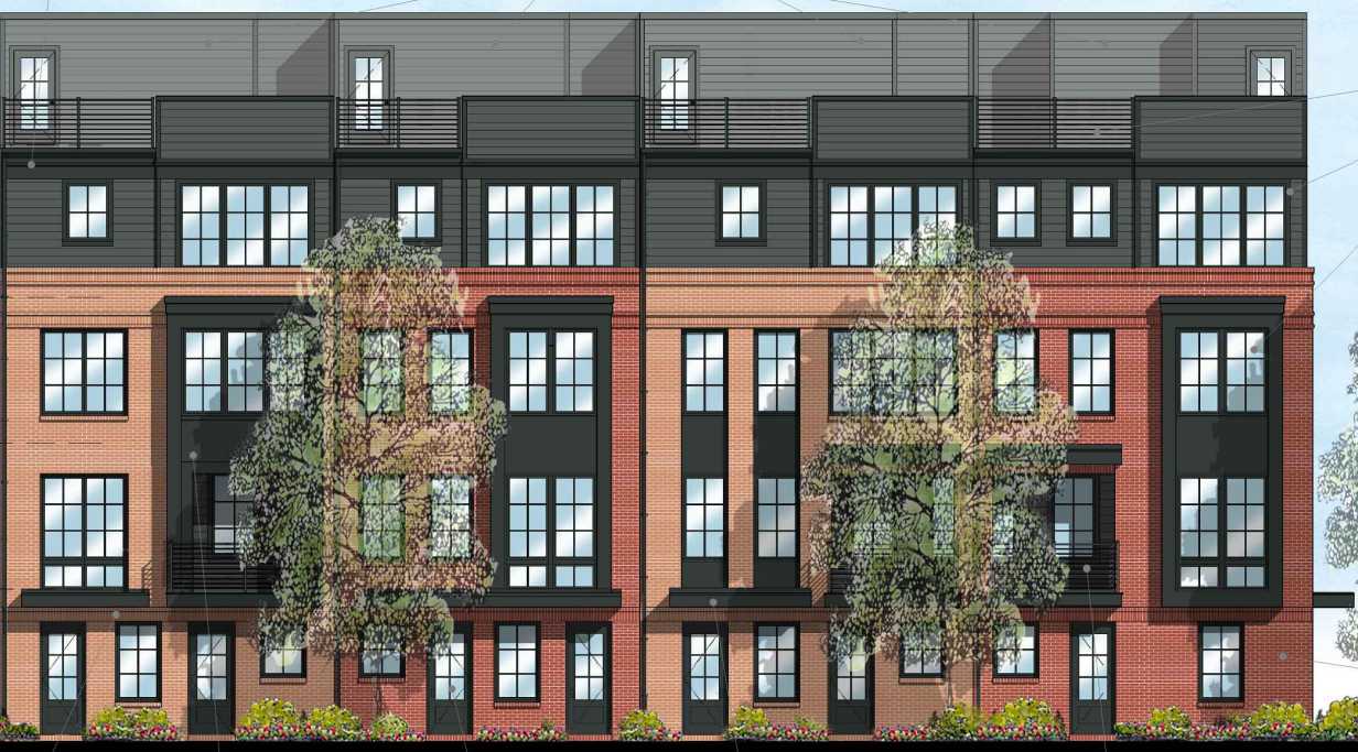 Multi-story brick and dark siding apartment building with large windows and trees in front.