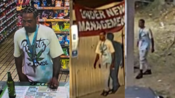 Man at a store checkout wearing a white T‑shirt with a large marijuana leaf graphic.