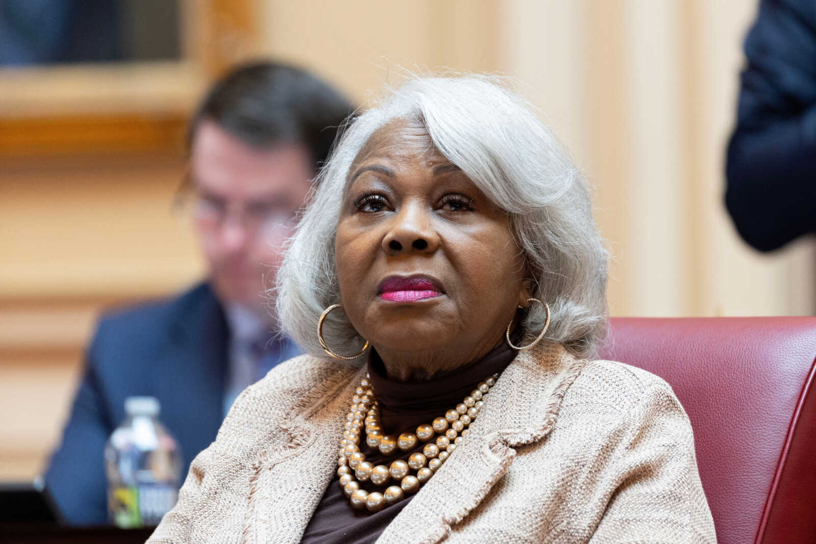 Virginia Senate President pro tempore Louise Lucas, D-Portsmouth, listens to debate on the Senate floor, Feb. 17, 2026, in Richmond, Va. (AP Photo/Ryan M. Kelly, File) | FFXnow Older African American woman with gray hair wearing a pearl necklace and beige blazer, sitting in a conference setting with a thoughtful expression.