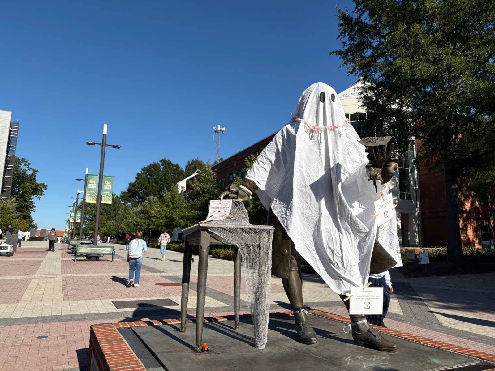 George Mason statue dressed as ghost on George Mason University's Fairfax campus (photo by Amy Woolsey) | FFXnow