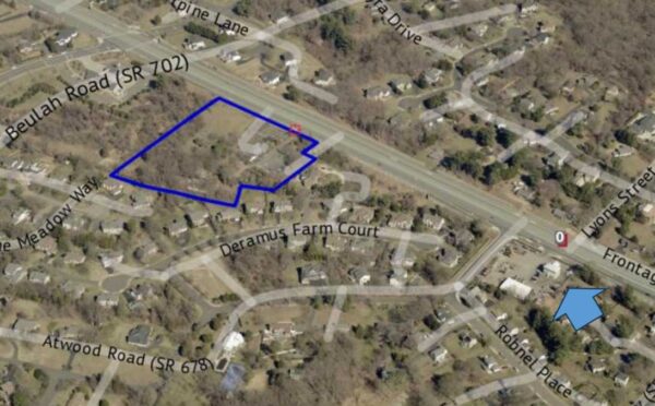 Aerial map showing a property outlined in blue along Beulah Road, with surrounding streets and houses nearby.