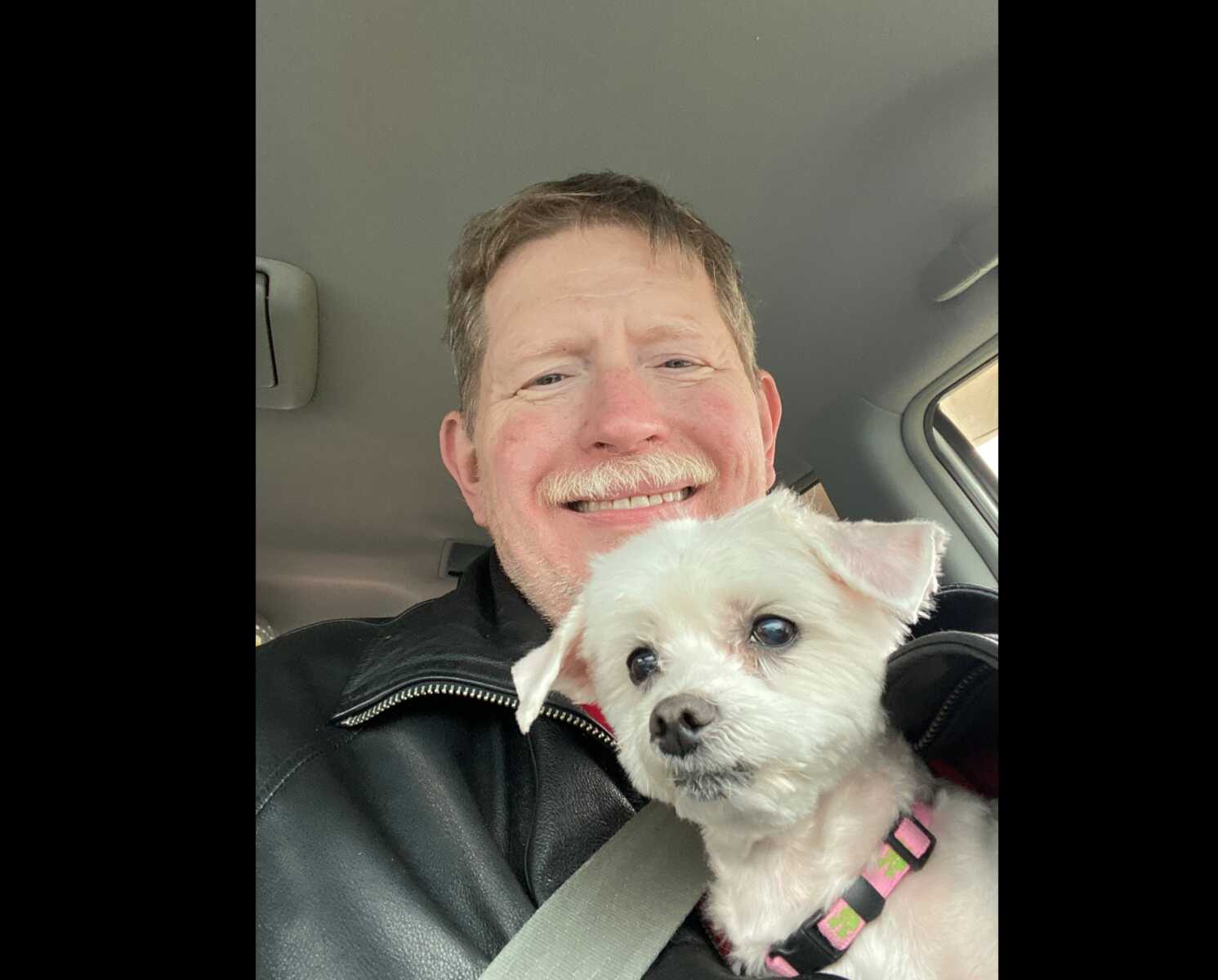 Stevan Porter with a dog (courtesy Stevan Porter for Herndon Council) | FFXnow