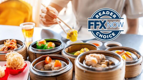 Chopsticks picking yellow dumpling from a bamboo steamer, multiple dim sum baskets on a table with sauces; circular 'Reader FFX Now Choice' badge overlaid on right.